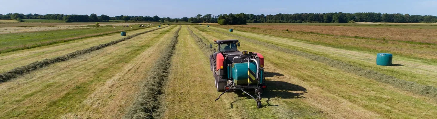Green field with a tractor