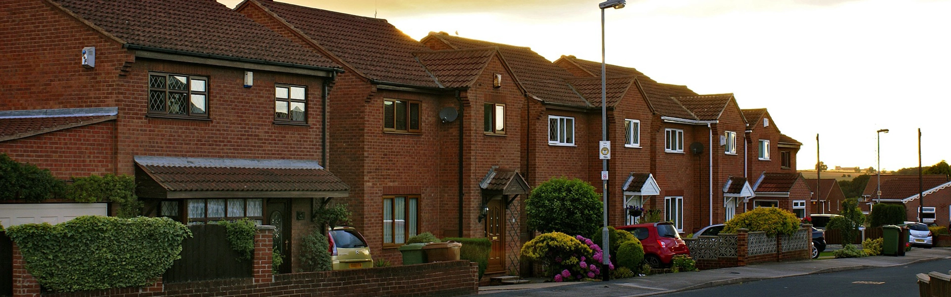 Street with closely packed modern red-brick houses